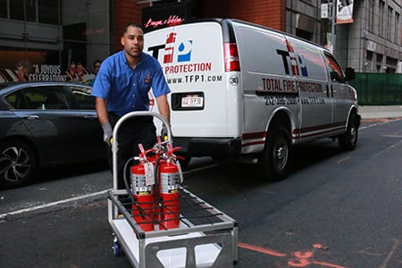 A TFP employee with fire extinguishers